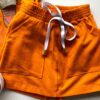 fernandaramoskids com br Conjunto Infantil Feminino Blusa Cropped Chinelo e Short Saia Laranja 2