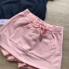 fernandaramoskids com br Conjunto Infantil Feminino Blusa Cropped Preto Short Saia Rosa 1