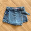 Short Saia Infantil Feminino Jeans com Bolsos e Detalhes Fernanda Ramos Kids