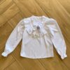 Camisa Manga Longa Infantil Feminina Babado e Amarração Branca Fernanda Ramos Kids