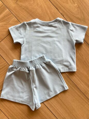 Conjunto Infantil Blusa Cropped com Detalhe e Short Saia Azul Fernanda Ramos KIds